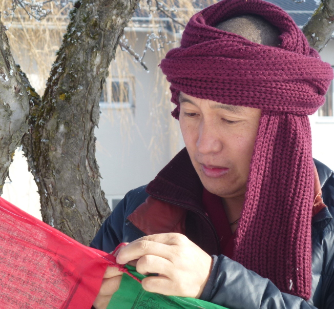 Geshe Samten Tsukphu tying Lungtas in Yeshe Sal Ling 2017